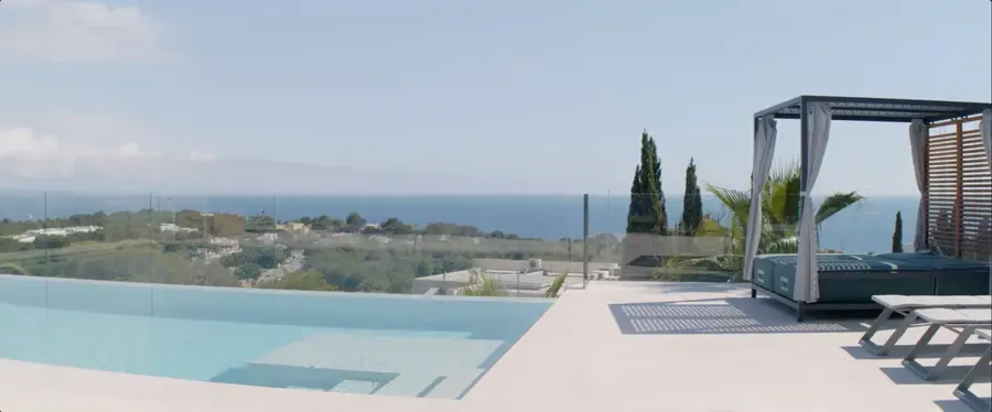 Infinity pool terrace with sea views and modern outdoor daybed at luxury Mediterranean villa