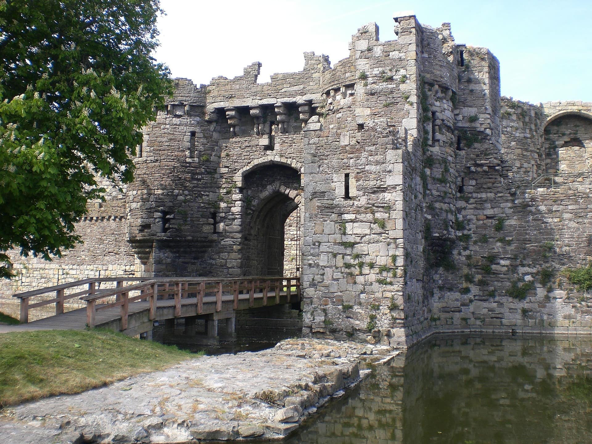 Medieval gatehouse and wooden drawbridge at Beaumaris Castle, Anglesey, a UNESCO World Heritage Site ideal for guests explor…