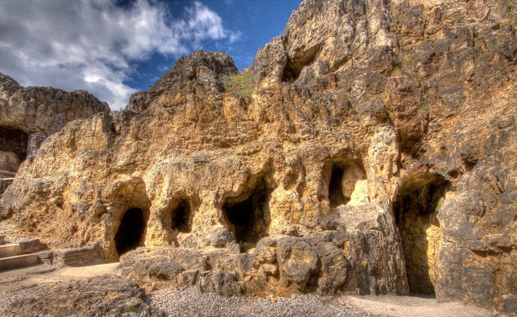 Ancient Bronze Age copper mine caves carved into the limestone cliffs at Great Orme, Llandudno, North Wales